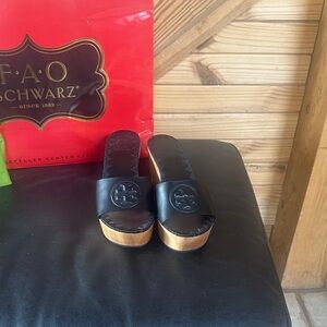 Tory Burch Black Leather Mules with Gold Accents